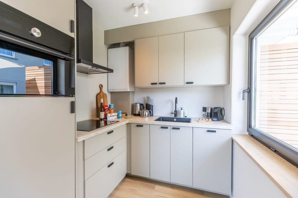 Modern kitchen with clean white finishes. 