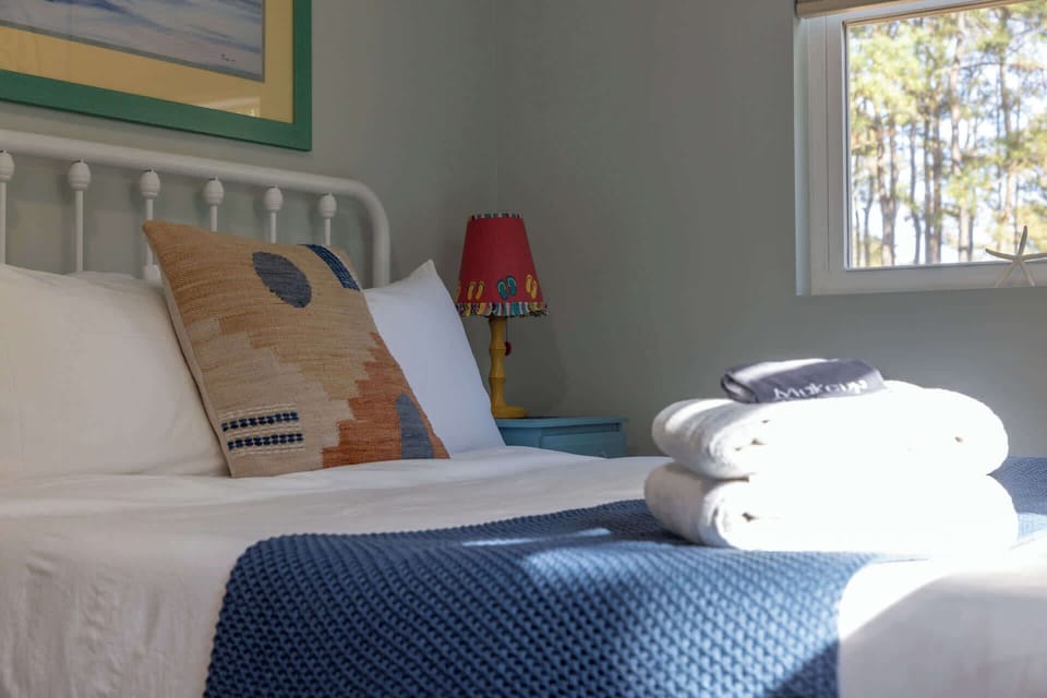 Spacious bedroom with a full bed and twin bed