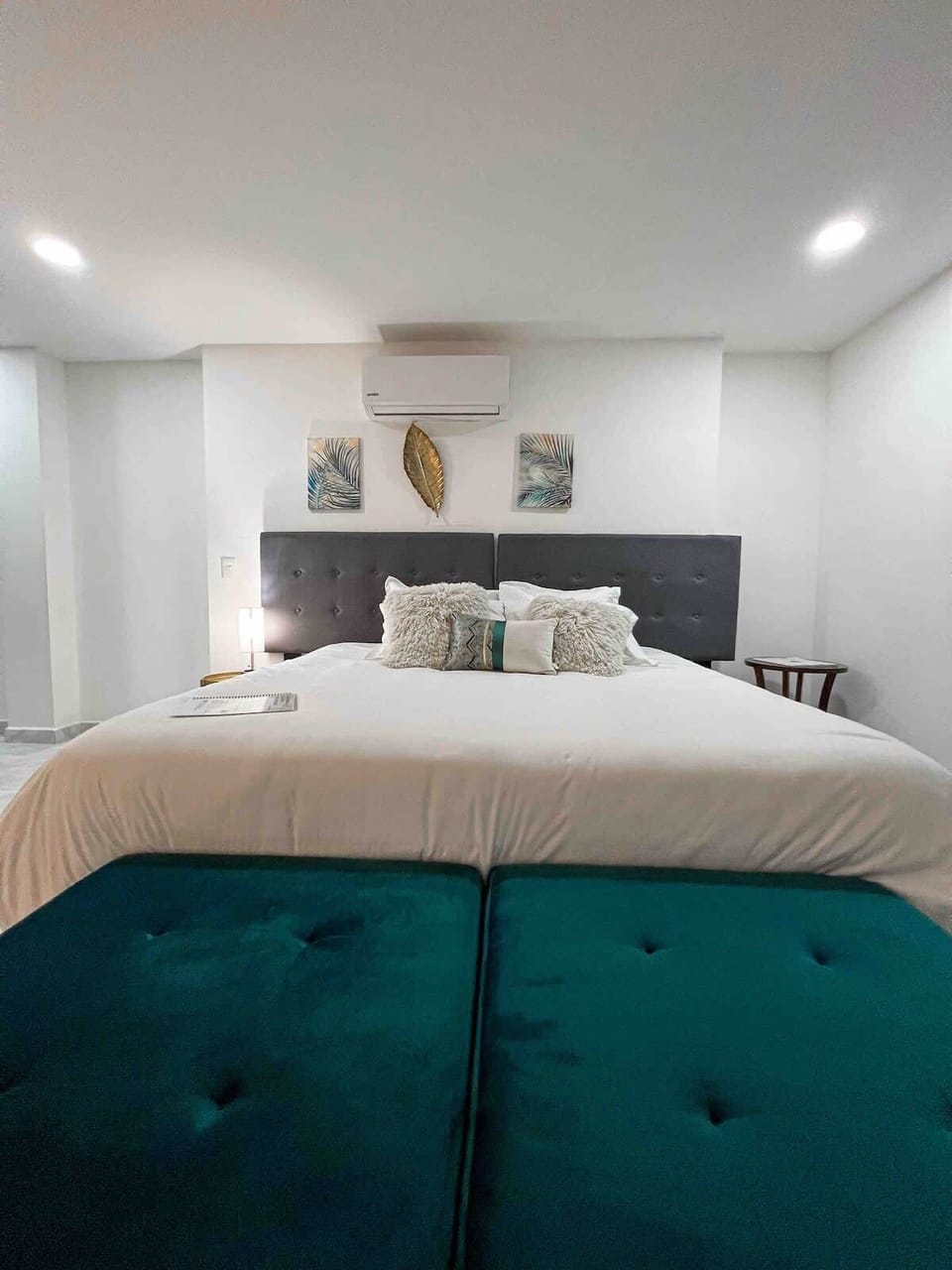 Serene bedroom w/ plush bedding & calming tones for a peaceful night