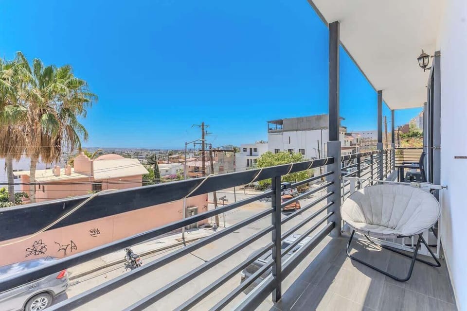 Private balcony terrace w/ seating, a breezy spot to relax outdoors