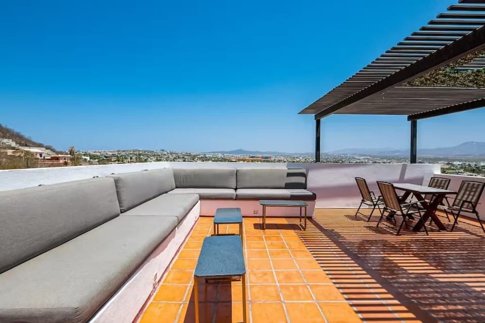 Shared balcony w/ seating & open views, a relaxing spot to unwind outdoors