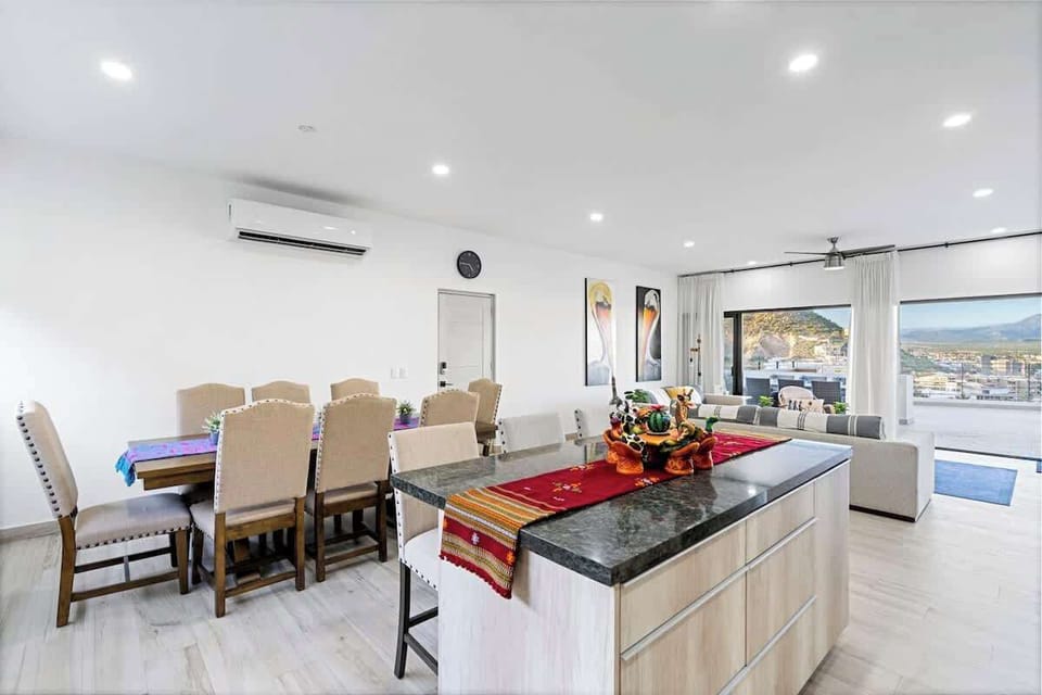 Bright kitchen w/ island seating & modern appliances for easy cooking