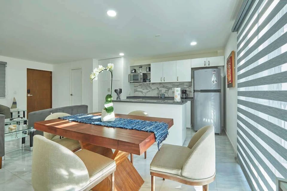 Dining space w/ table for shared meals in a bright, open setting