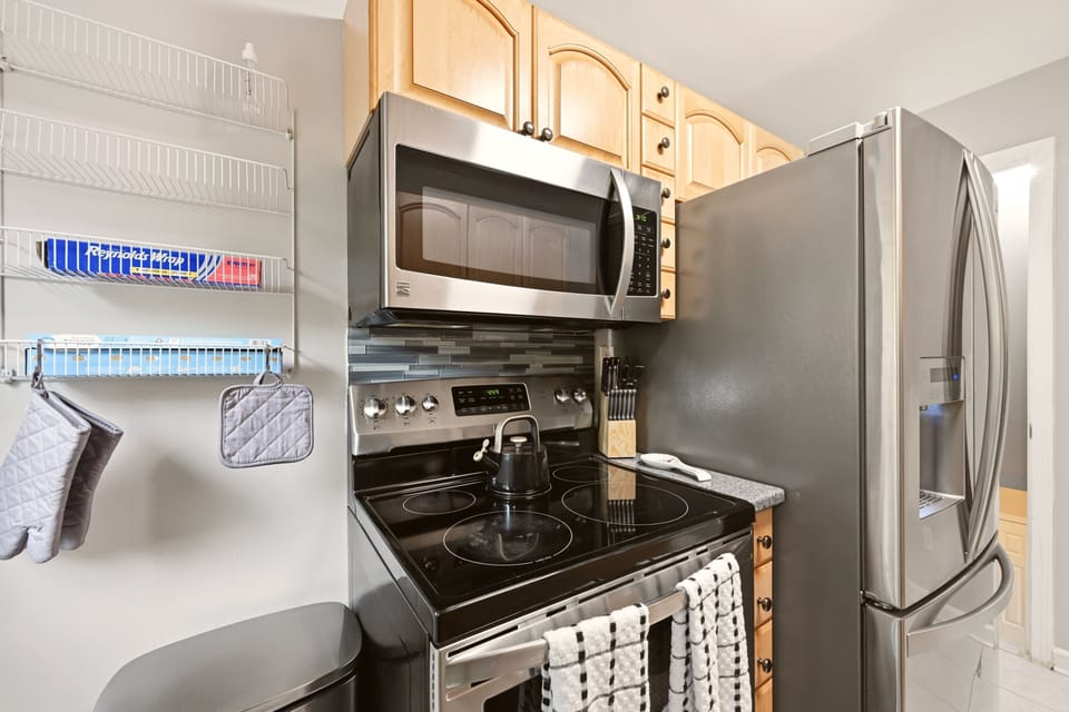 Electric range & stove, French door fridge, kettle and knife set included.