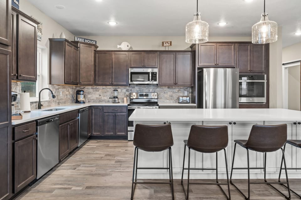 Kitchen has coffee maker, mixer, toaster, blender, large pots, pans, cookie sheets, griddle, silverware, dishware, glassware, utensils, etc. 