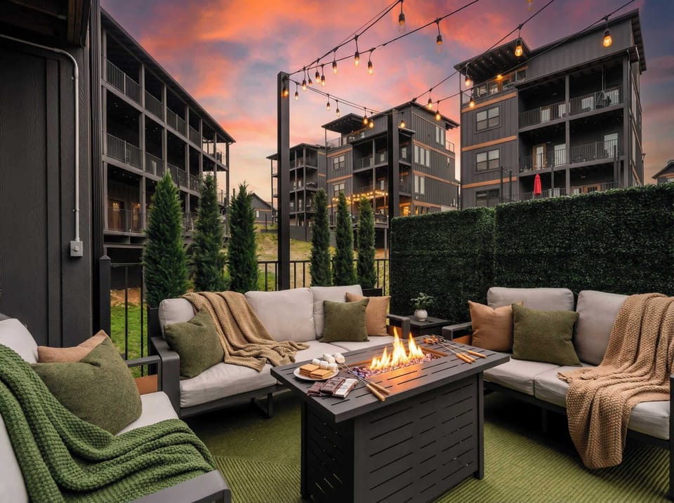 Sunset patio lounge w/ cushioned seating, fire table & relaxing evening vibes