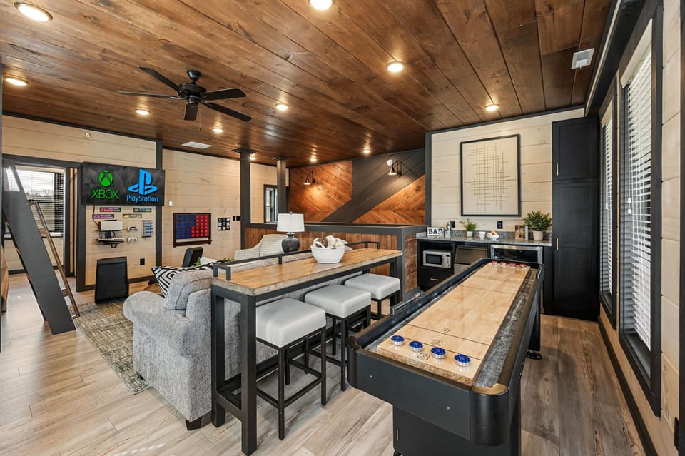 Rustic-modern kitchen w/ large island seating, sleek appliances & warm wood finishes