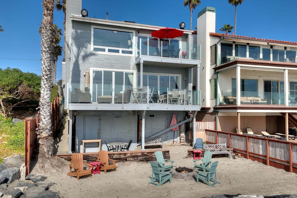 Exterior view showcasing beachfront access and outdoor seating area