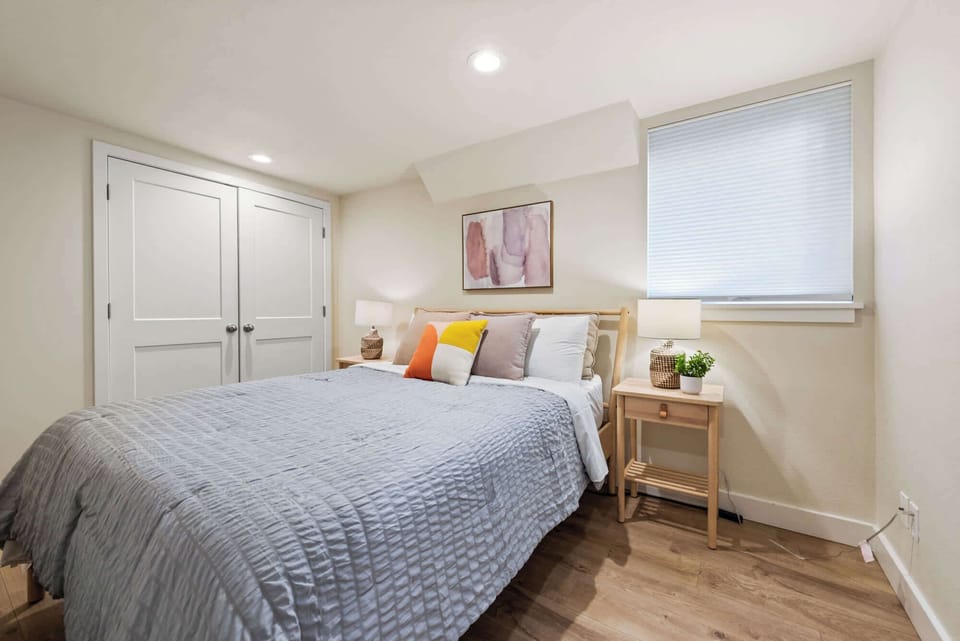 Unwind in a bright, cozy bedroom that offers a peaceful escape at the end of your day.
