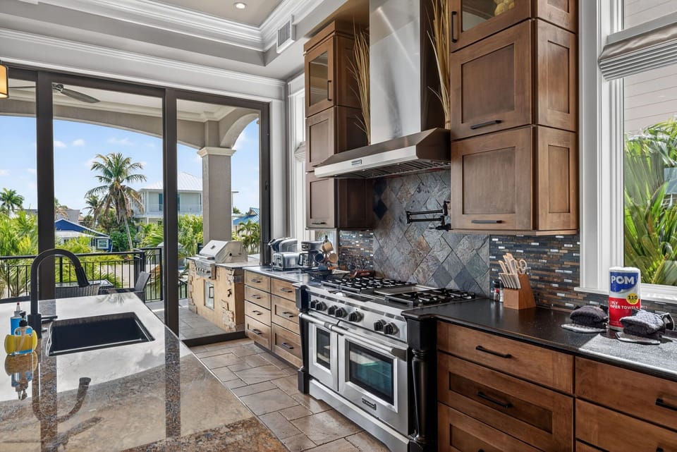 Chef's kitchen feature gas stovetop double oven and all the conveniences of home