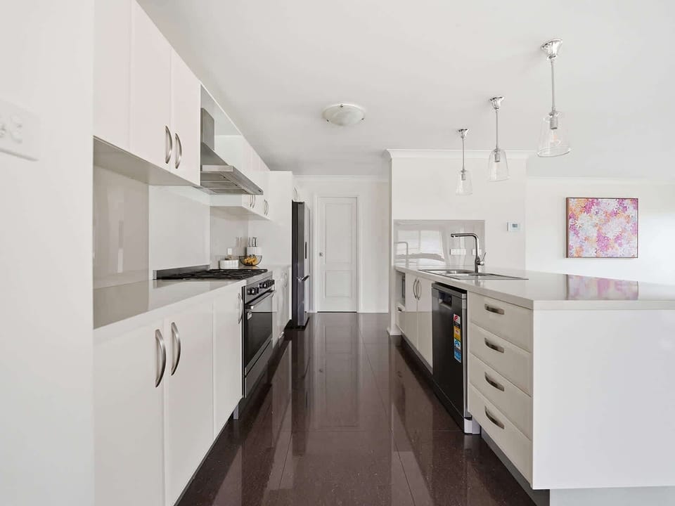 Well-Equipped Kitchen + Breakfast Stools