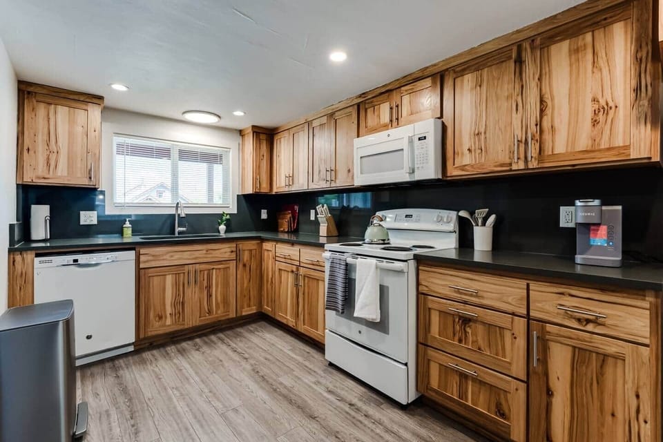 Full kitchen with coffee pot, Keurig, Tea Kettle, Ice Maker, toaster, as well as cooking oils and basic spices.