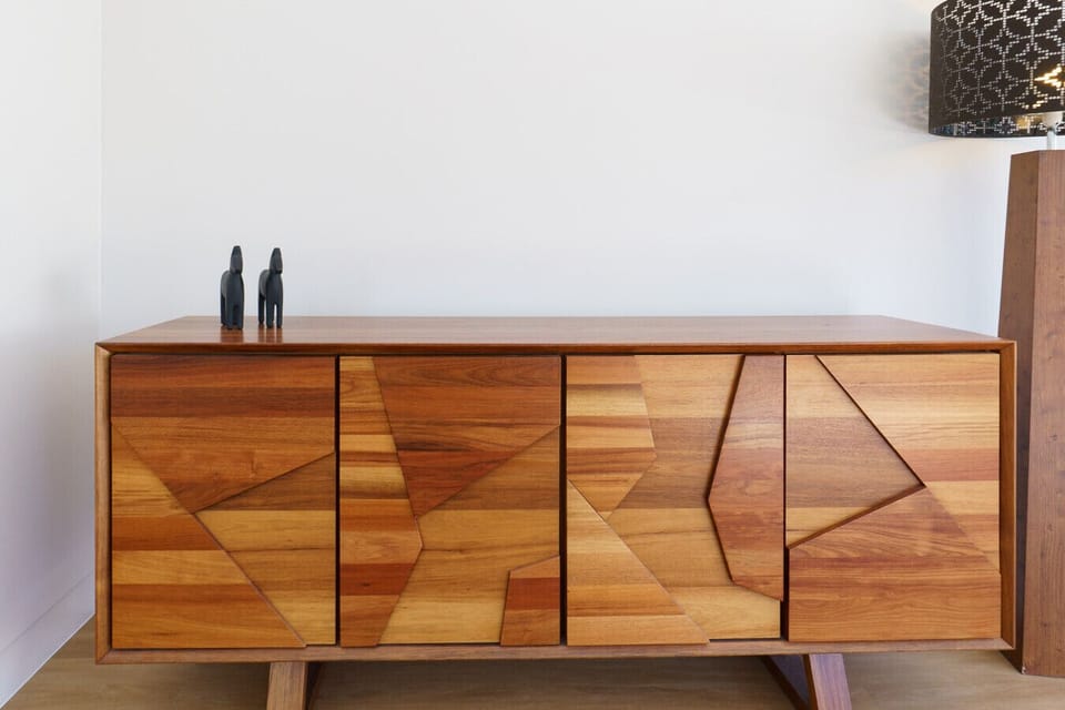A stylish timber sideboard that adds warmth and personality to the home’s inviting interior.