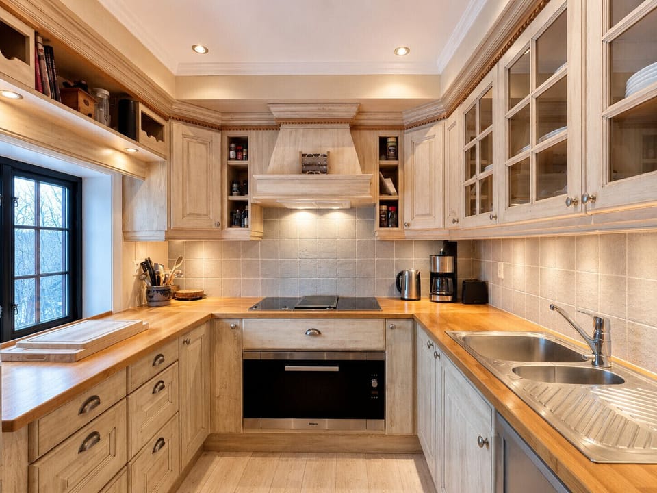 Modern, equipped kitchen with stove, oven, and plenty of counter space