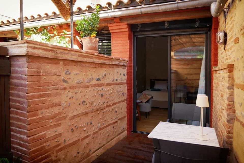 A charming bedroom with a private terrace