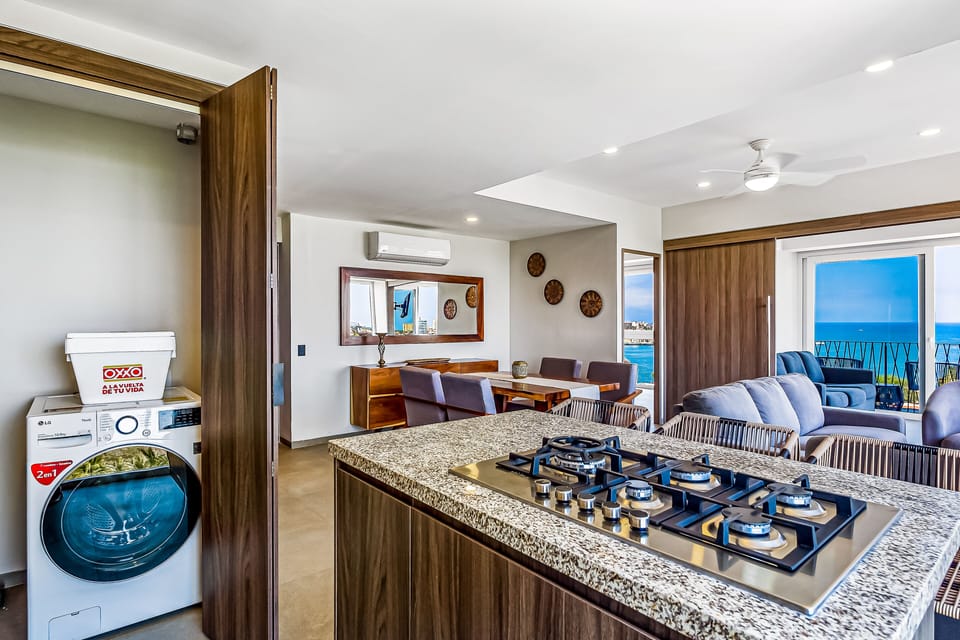 Enjoy maximum convenience with a functional laundry closet housing an in-unit washer, neatly tucked right off the main kitchen area.