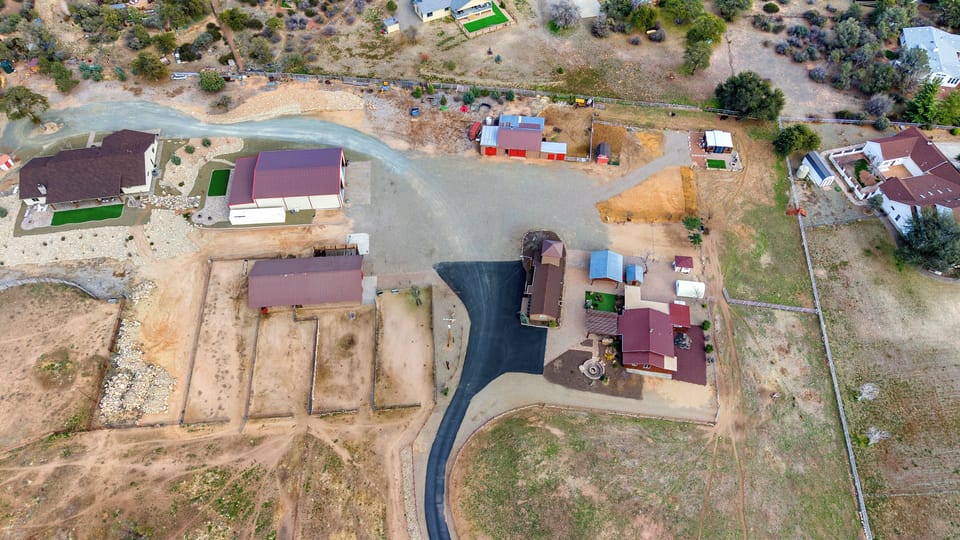 Zebra Ranch spans 10 acres with RV space, homes, rec barn, sports courts, and a venue-all within easy reach for a memorable stay, whether you rent the full compound or just the RV space. Enjoy sunsets, open skies, and unique ranch experiences.