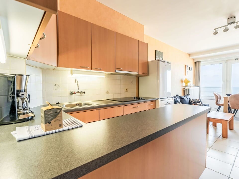 Interior Design, Flooring, Floor, Kitchen, Furniture, Countertop, Wood, Ceiling, Cabinetry, Room