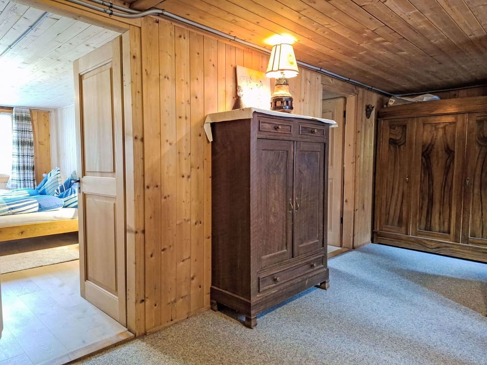 Furniture, Wood, Interior Design, Flooring, Floor, Ceiling, Room, Lighting, Hardwood, Cabinetry