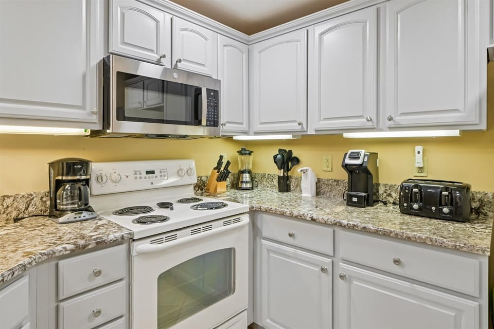 Cook your favorite meals in this fully equipped kitchen with granite counters, modern appliances, and everything you need for a comfortable stay.