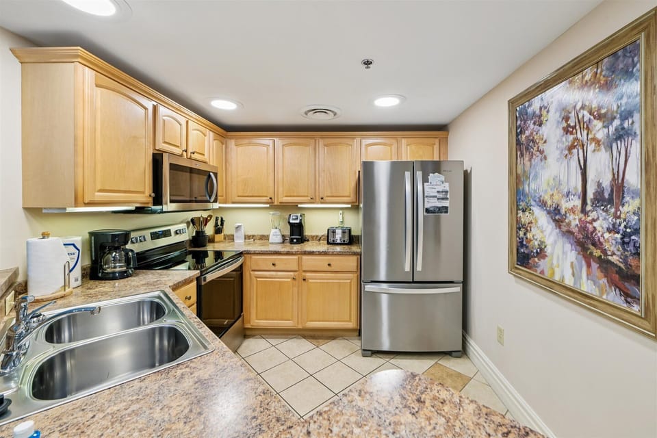 Your fully equipped kitchen features modern appliances and granite countertops, perfect for preparing meals during your stay.