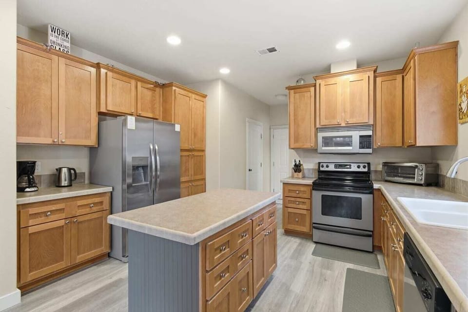 Fully stocked kitchen with stainless steel appliances
