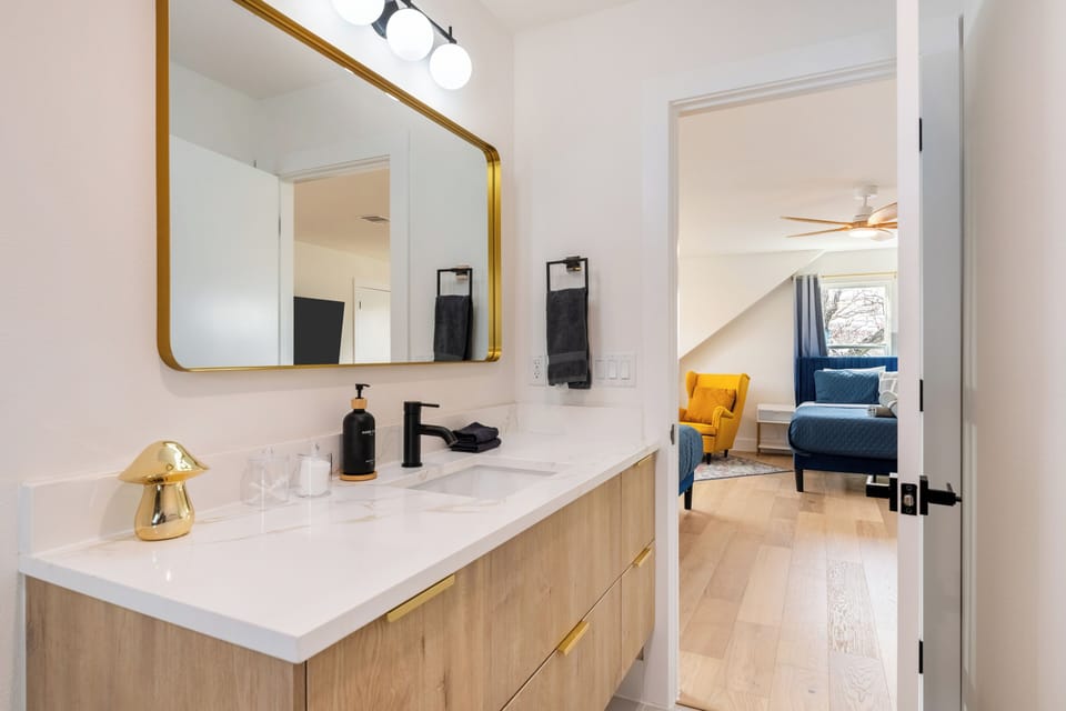 Stylish bathroom connected to Bedroom 4, featuring modern finishes and a spacious vanity—creating a convenient ensuite-style setup for added comfort and privacy.