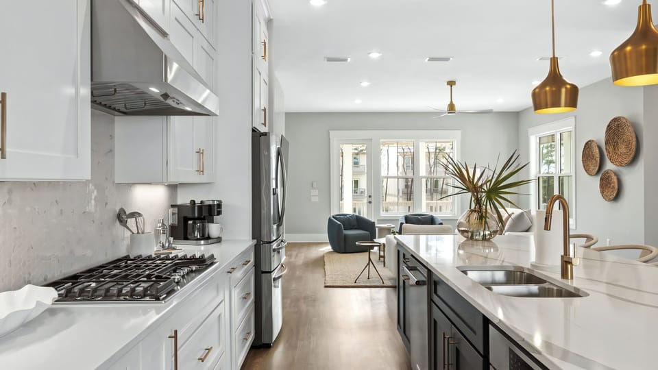 A seamless living design that blends the kitchen and lounge beautifully.