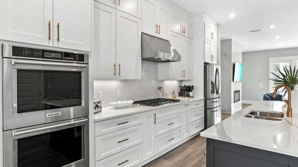 Thoughtfully designed with premium appliances, a gas range, and double wall ovens.