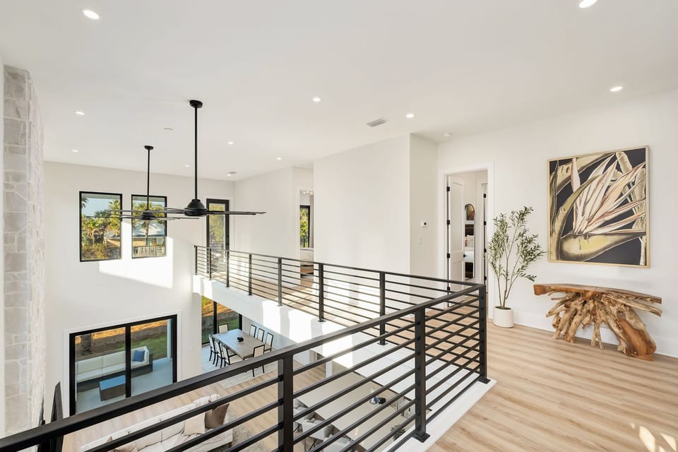The upstairs landing offers an open overlook, connecting each space with a sense of ease.
