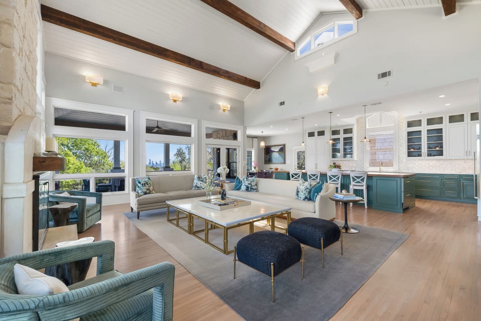 Great room to kitchen — Austin skyline through the windows.