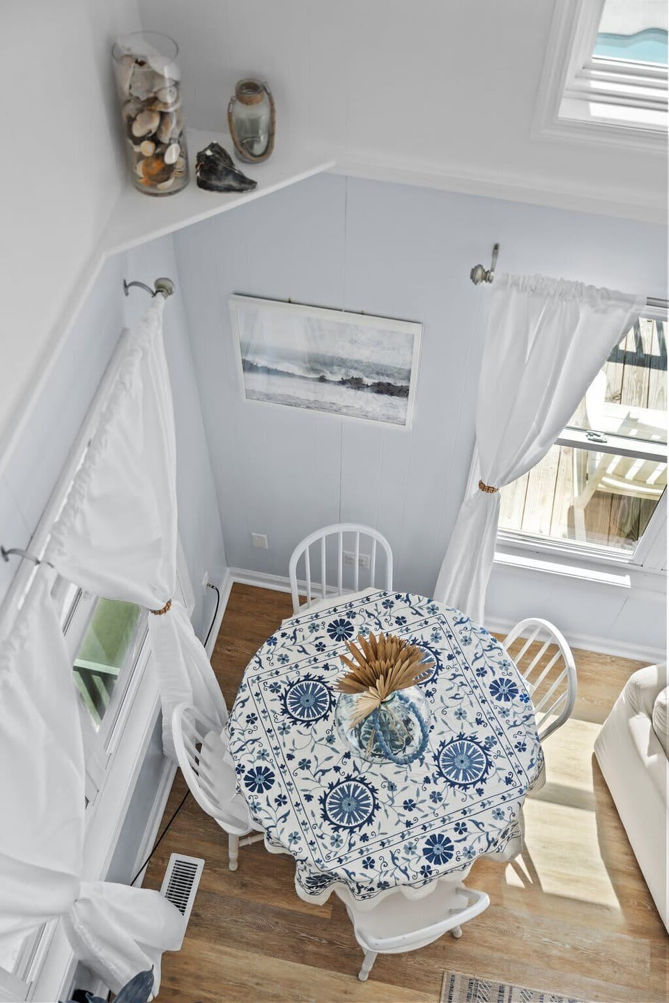 Mid Level: Tea table by the living area with an ocean view