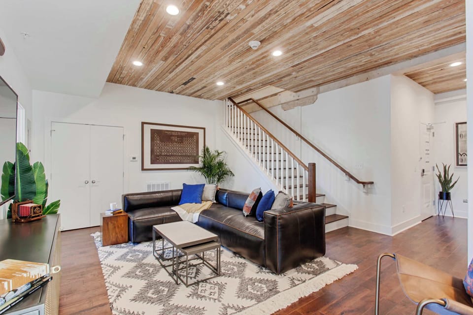 Living Room | Comfortable Seating Area with TV | First Floor of Third Floor Unit