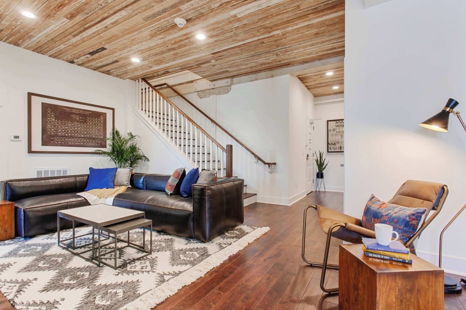 Living Room | Comfortable Seating Area with TV | First Floor of Third Floor Unit