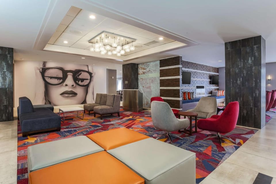 Settle into stylish lounge seating beneath warm, modern lighting.