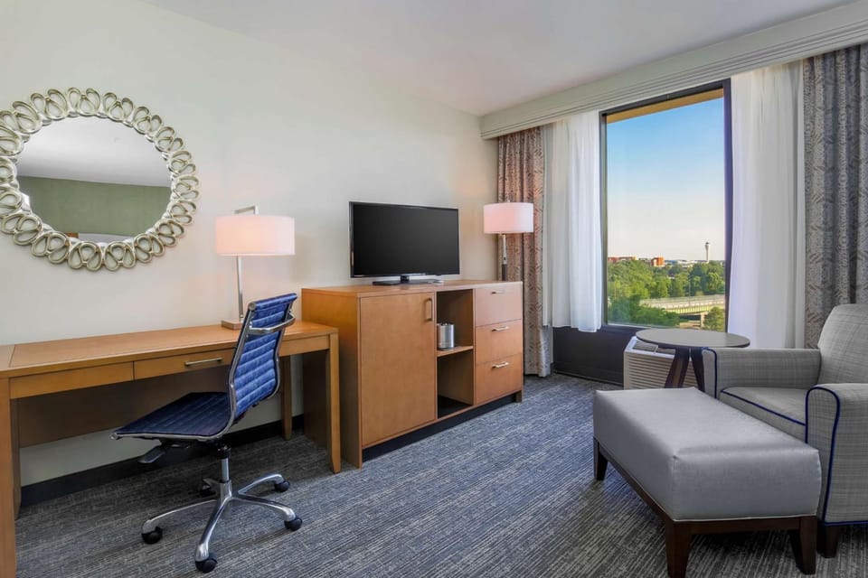 Unwind in a spacious king room with cozy seating.