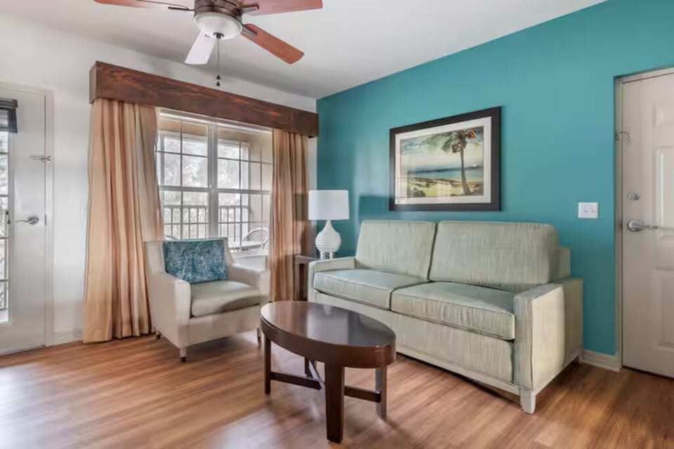 Sip coffee by the window in a relaxed lounge setting.
