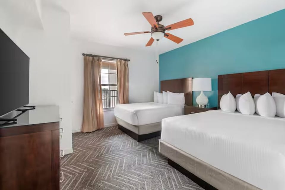 Stretch out with two beds and a calm, cozy setup.