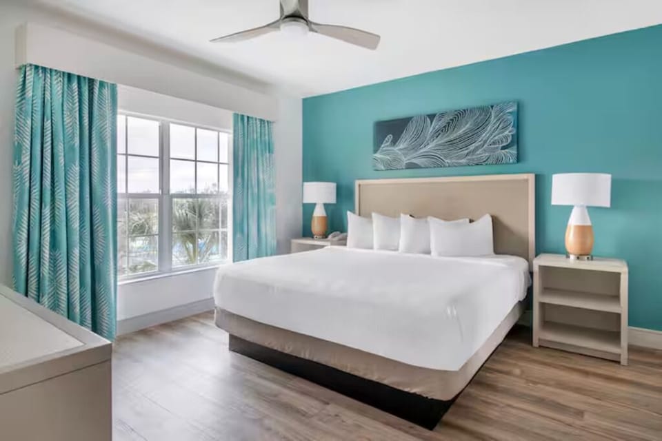 Unwind in a bright king bedroom with breezy coastal tones.