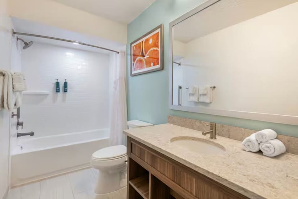 Rinse off in a clean, modern shower-tub combination.