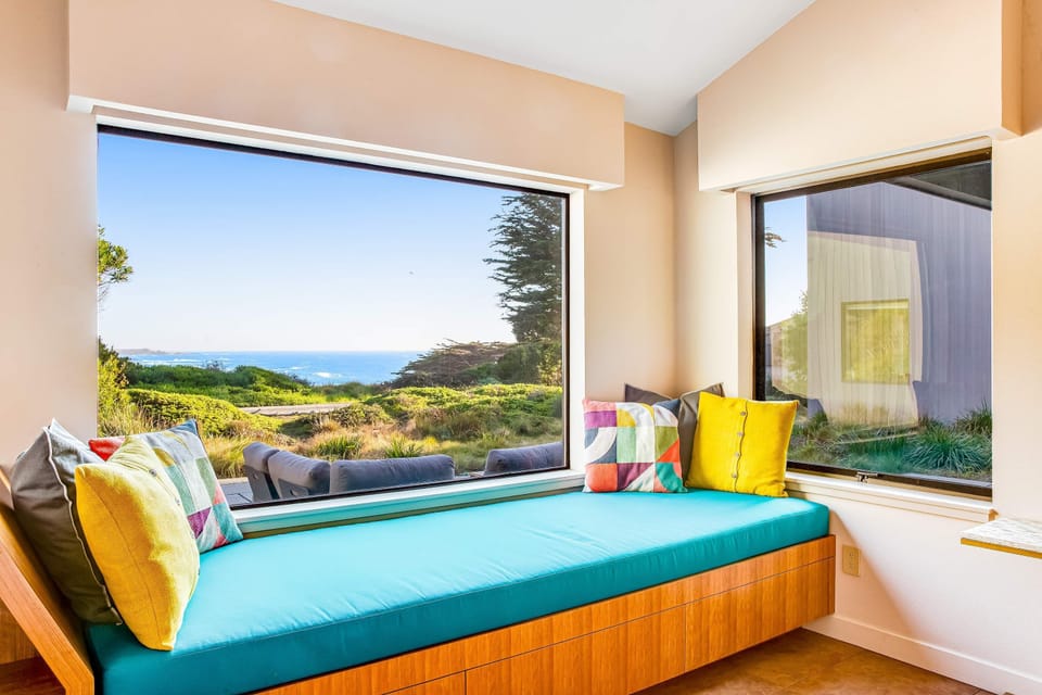 This serene window seat offers the perfect spot to daydream or sip your favorite drink as the coastal breeze drifts by.