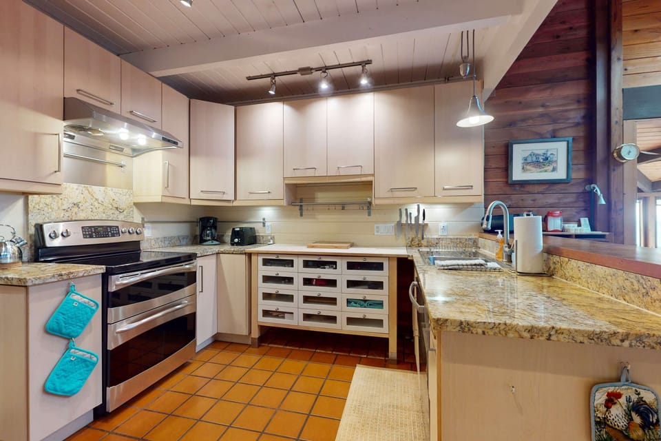 Craft culinary masterpieces in this modern kitchen, complete with sleek appliances and ample counter space for your cooking adventures.