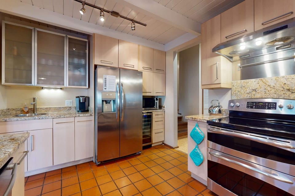 The kitchen flows seamlessly into the living area, making it easy to entertain while enjoying the company of loved ones.