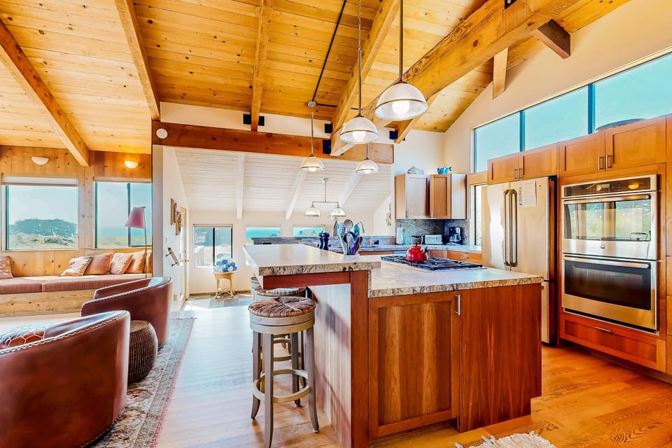 Cook up your favorite meals in the modern kitchen, equipped with everything you need to create delicious dishes while enjoying ocean views.