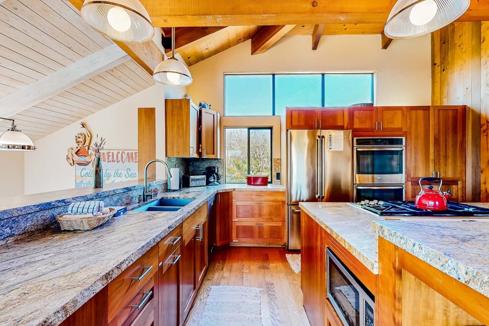 With ample counter space and natural light, this kitchen invites you to create delicious meals while enjoying the beauty outside.