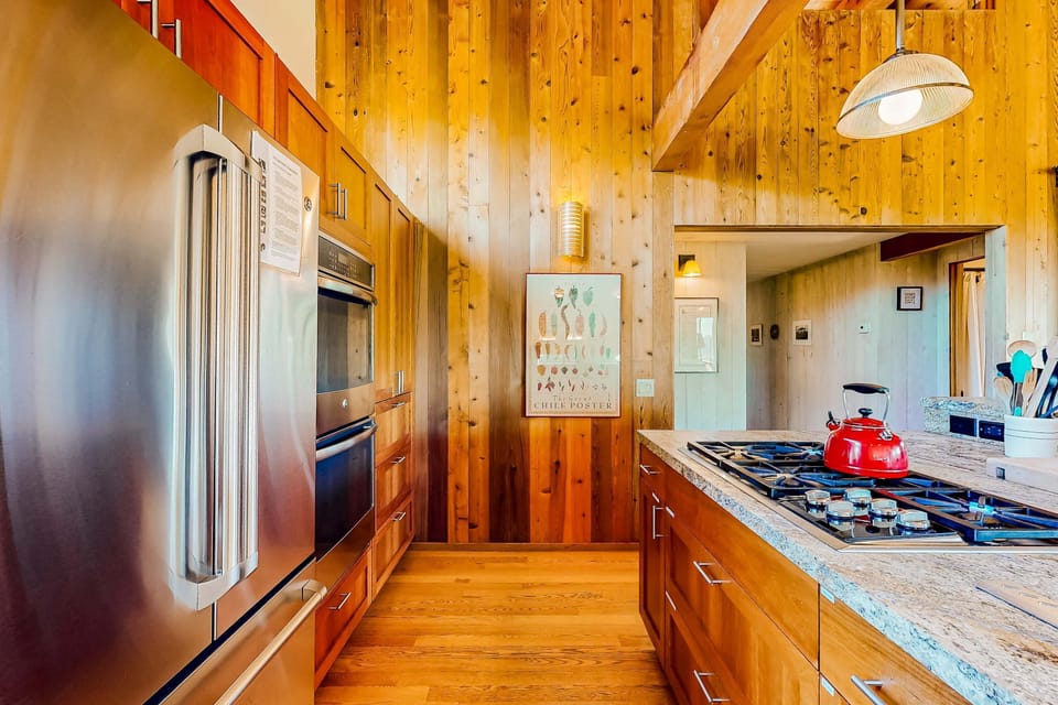 Embrace your inner chef with state-of-the-art appliances and a warm, inviting atmosphere, perfect for cooking and entertaining.