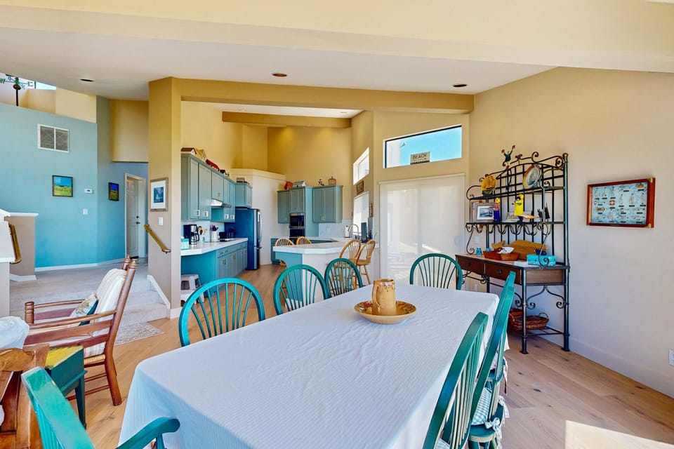 Dine in style at this inviting table, where the ocean view enhances every meal, making family gatherings truly unforgettable.