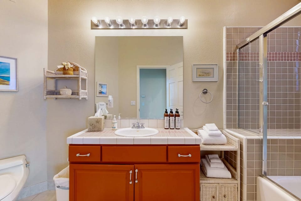 Rejuvenate in this stylish bathroom, designed for relaxation with ample space and a calming atmosphere after a day of exploration.