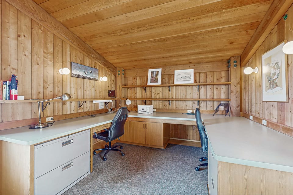 Create your perfect workspace in this dedicated office area, designed for productivity with natural light and serene coastal vibes.
