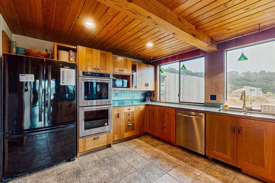 Whip up your favorite dishes in this well-equipped kitchen, featuring modern appliances and views that inspire culinary creativity.